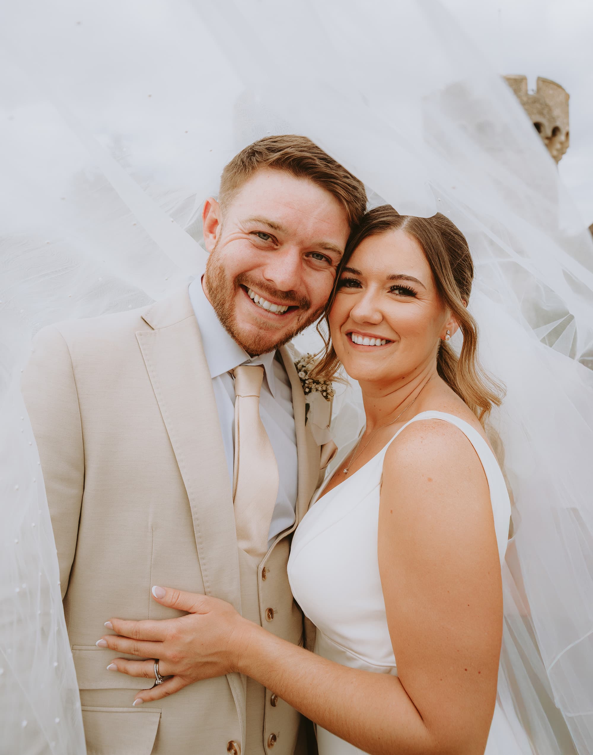 Bride and groom portrait cooling castle barn